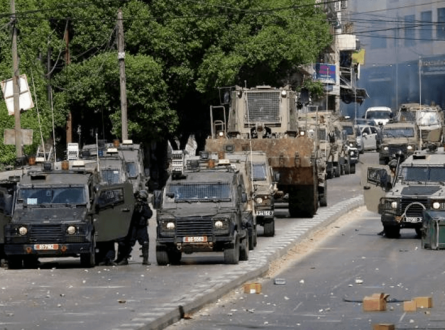 شهيد واعتقال مطارد في نابلس